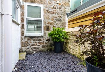 The small courtyard is perfect for storing beach gear.