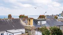 Enjoy sea views over St Ives' quirky rooftops.