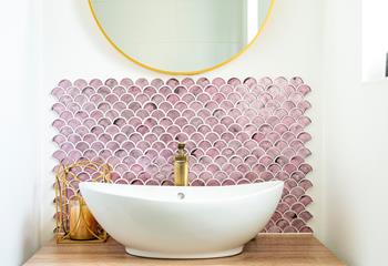 We love the splash back design behind the stylish sink!