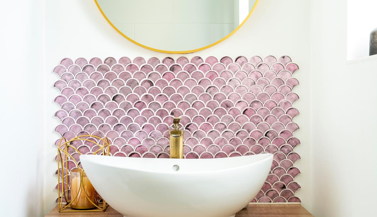 We love the splash back design behind the stylish sink!