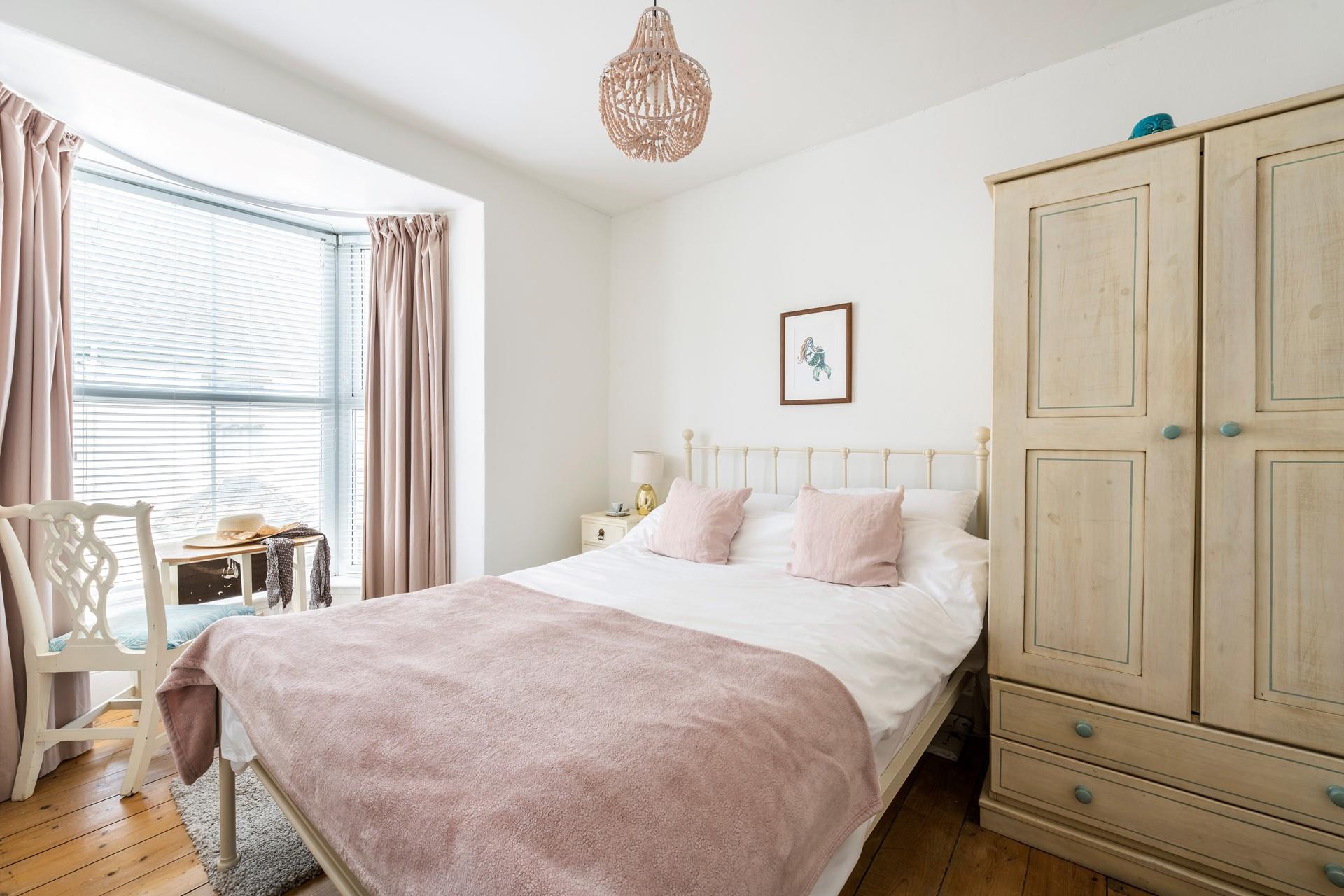 Pastel tones in the bedroom make a calming space to relax each night.