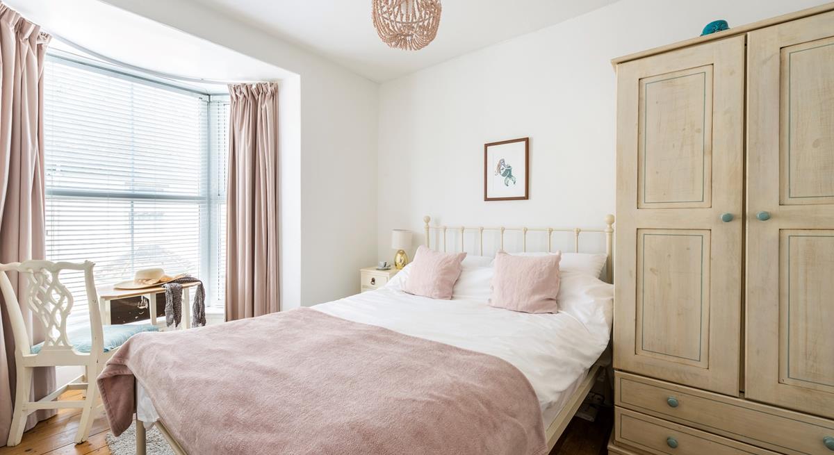 Pastel tones in the bedroom make a calming space to relax each night.