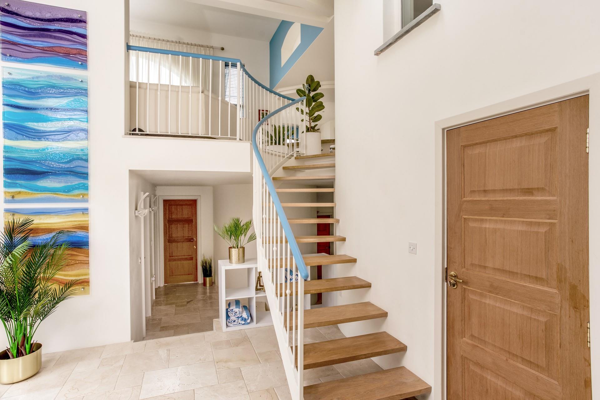 Climb the stairs to the open plan living area in this reverse-level house.