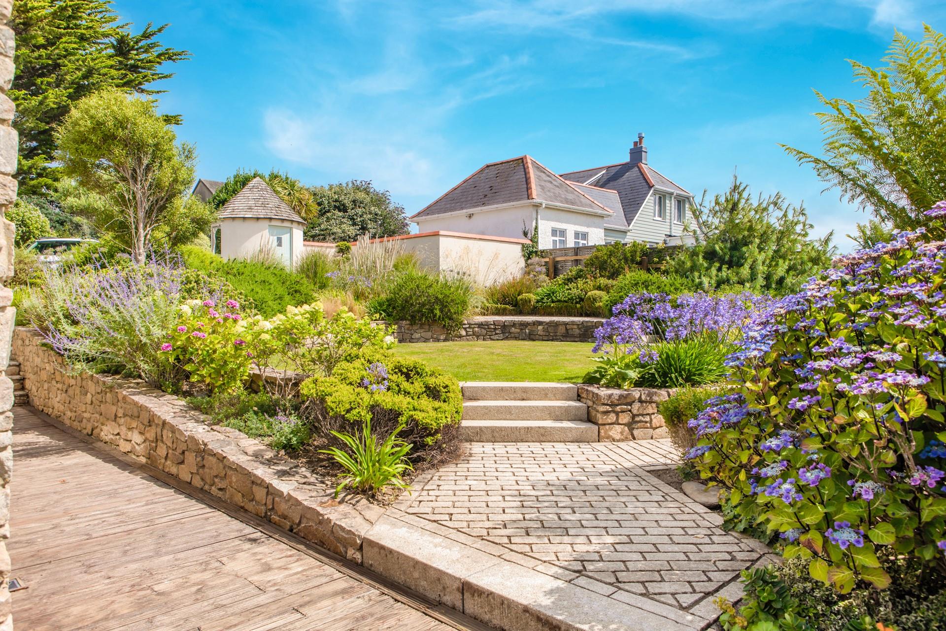The garden is bursting with colour and fragrant blooms.
