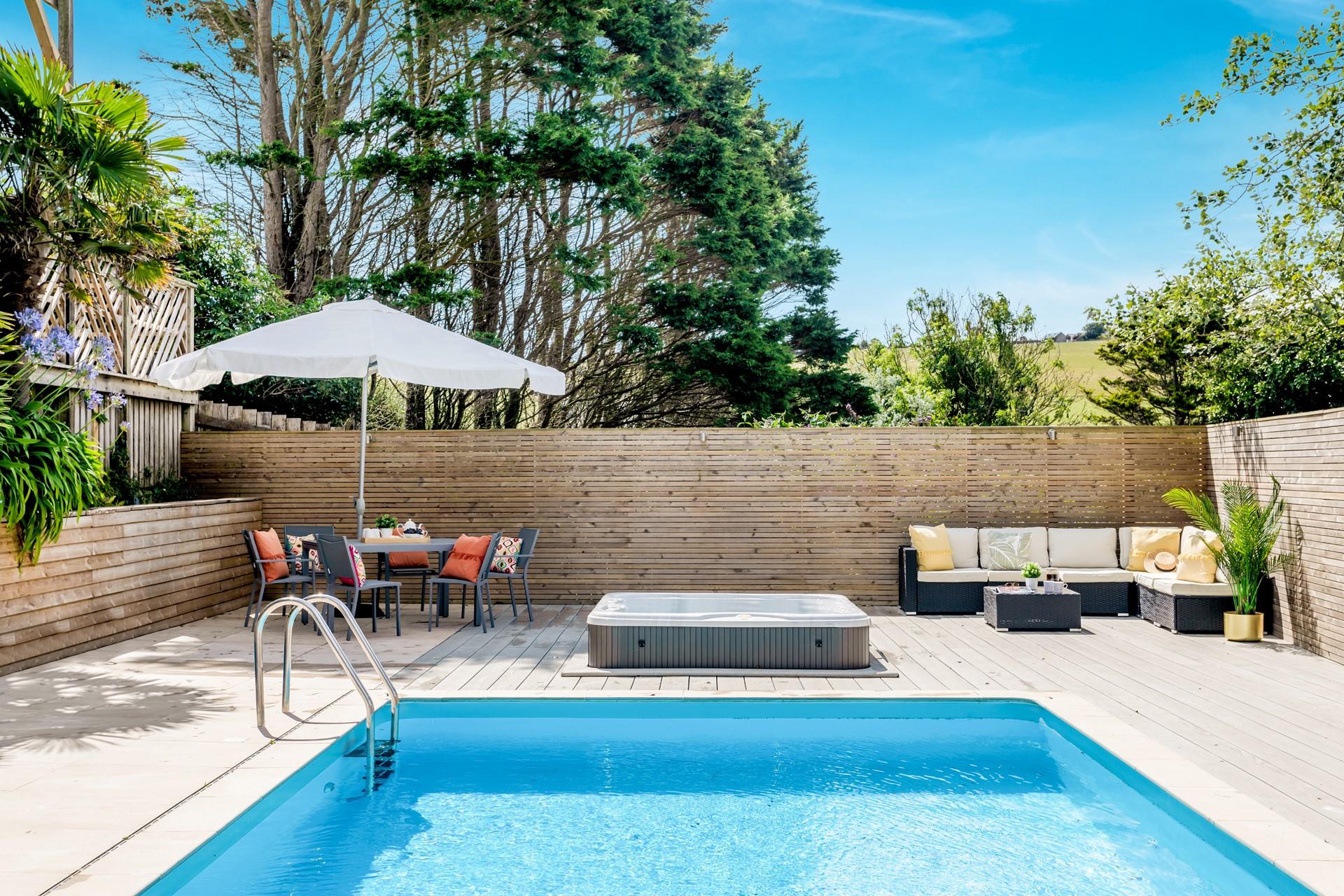 Sunbathe on the decking area after a swim in the heated pool to dry off.