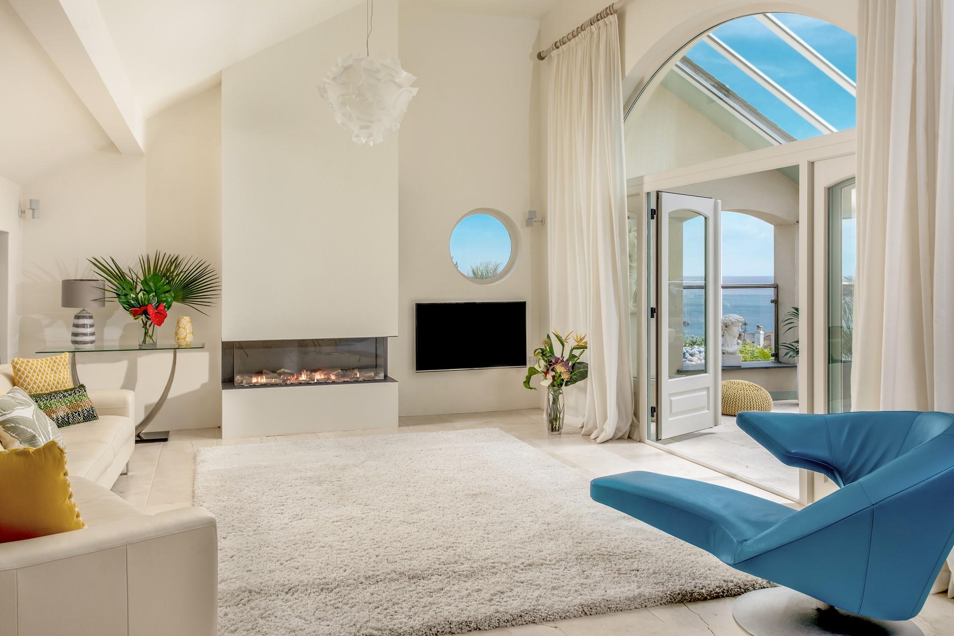 Open the doors to the balcony and let the warm summer breeze run through the living space.