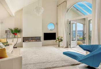 Open the doors to the balcony and let the warm summer breeze run through the living space.