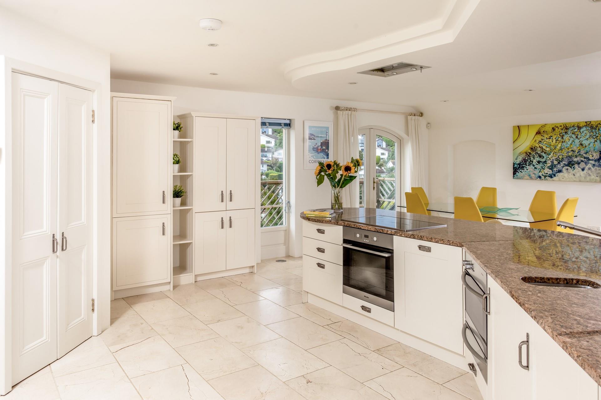 The kitchen is spacious with all the appliances you need to cook up a storm.