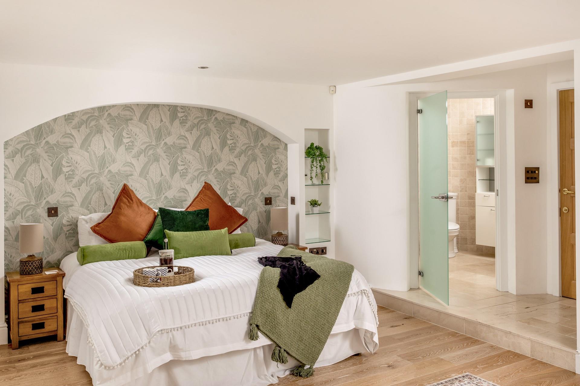 Start the day sipping a fresh pot of coffee on the soft sheets of the sumptuous bed. 