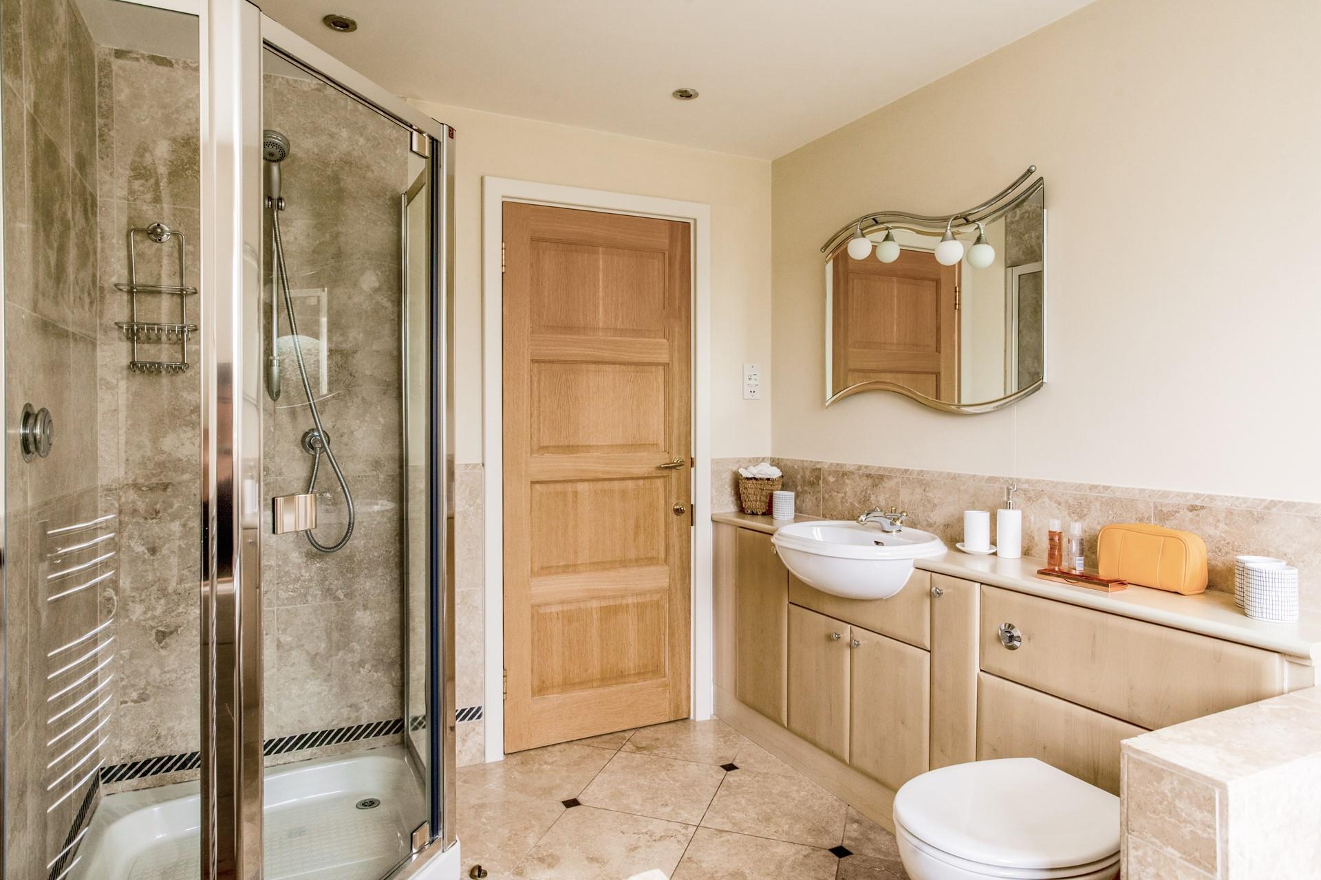 Wash off sandy toes in the family bathroom after spending the day at a beautiful beach nearby.