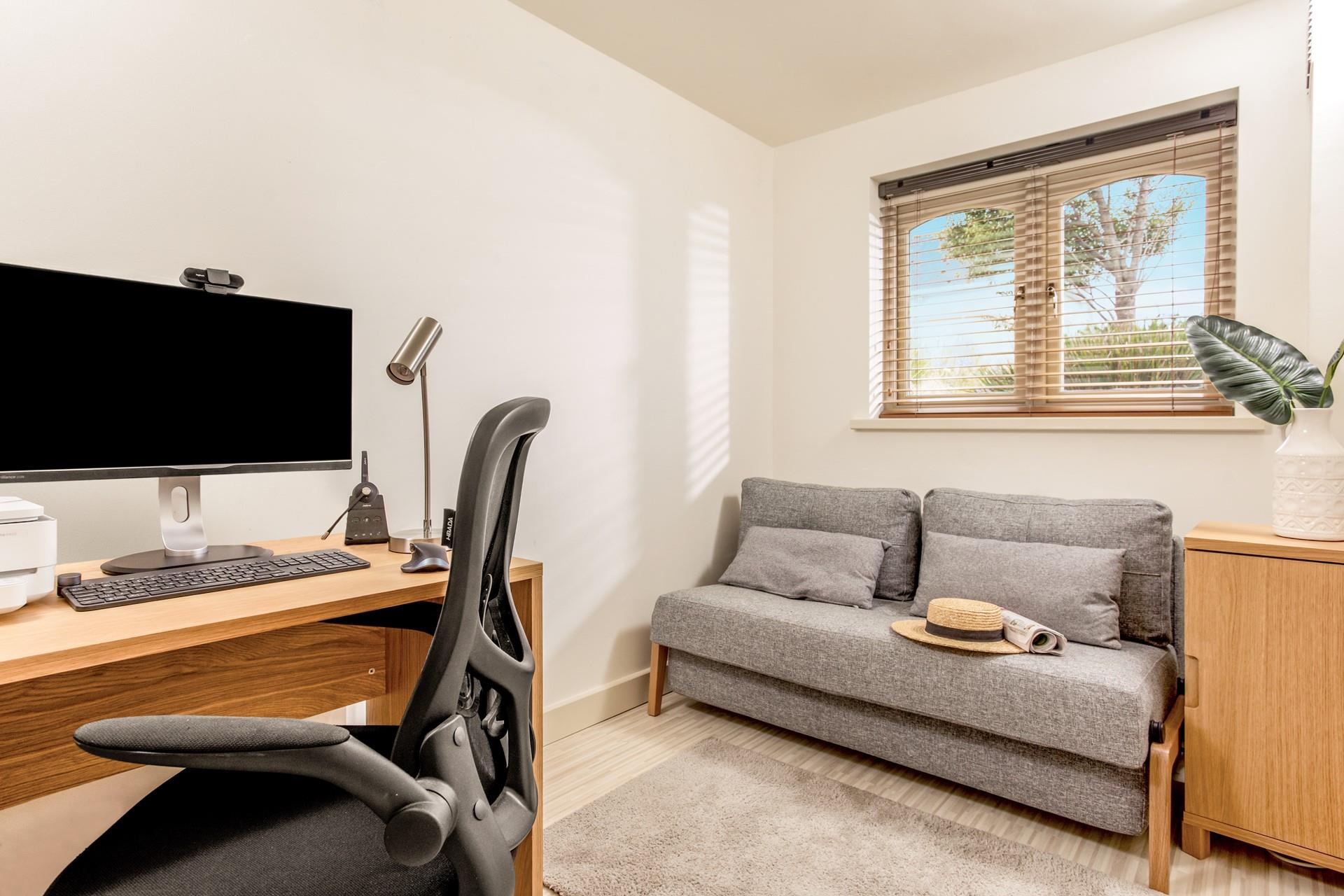 The office is a space to catch up on emails if needed.