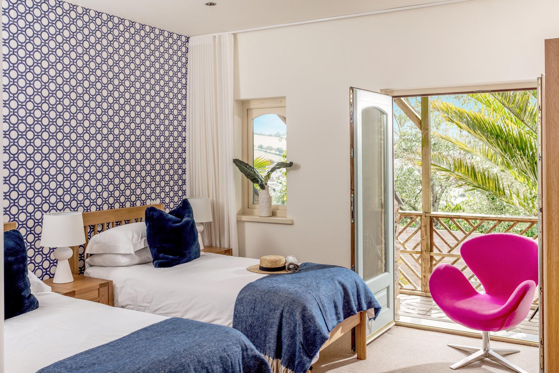 Bedroom 3 has twin beds and also has a door to the decked area, perfect for stargazing before tucking into bed.