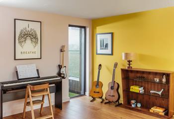 Budding musician? The music area is an added luxury to the living space.