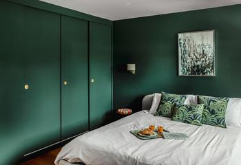 Decorated in stylish deep green, bedroom 3 has a luxurious super king size bed for a relaxing night's slumber.