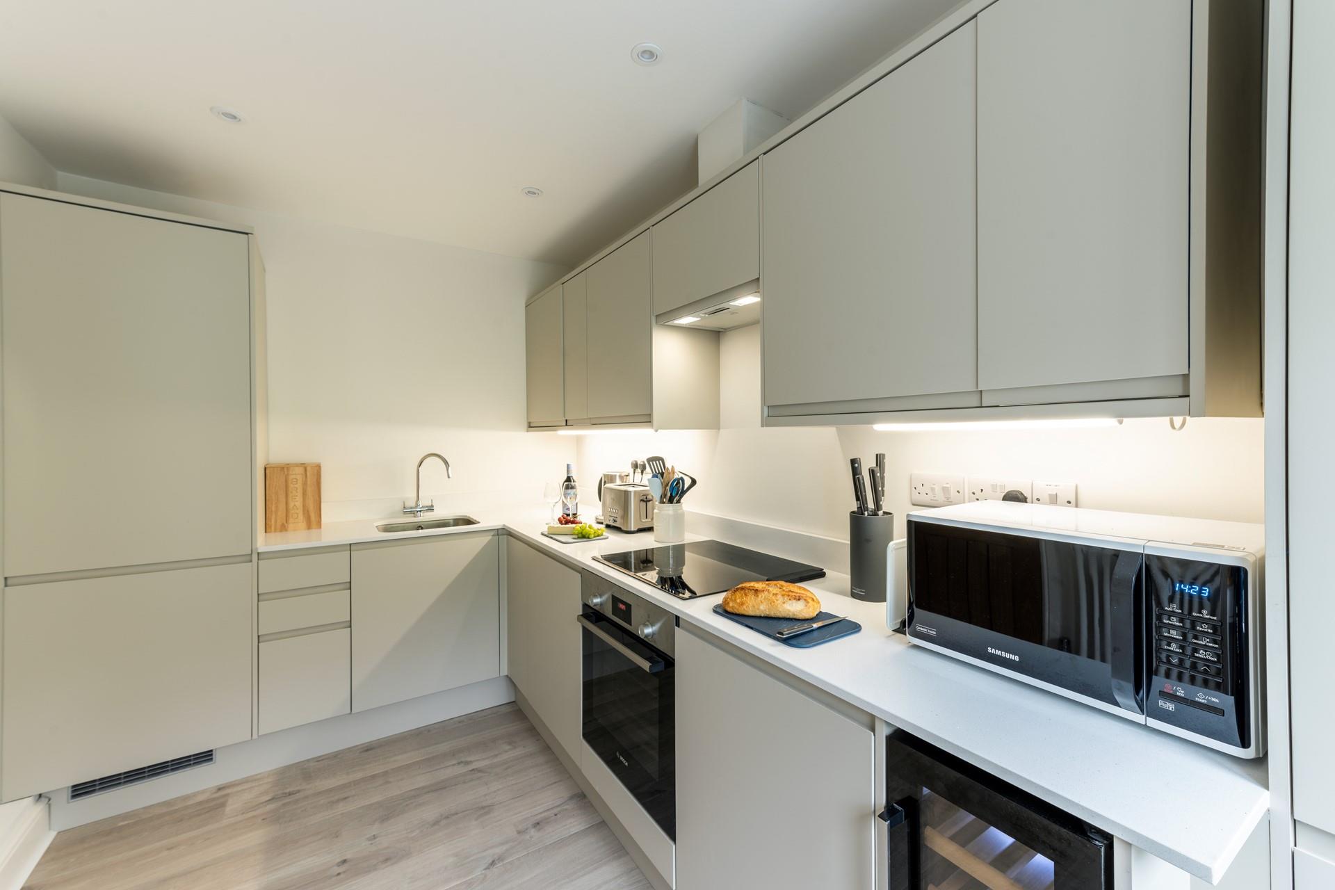 The kitchen is modern and well-equipped for cooking up a storm.