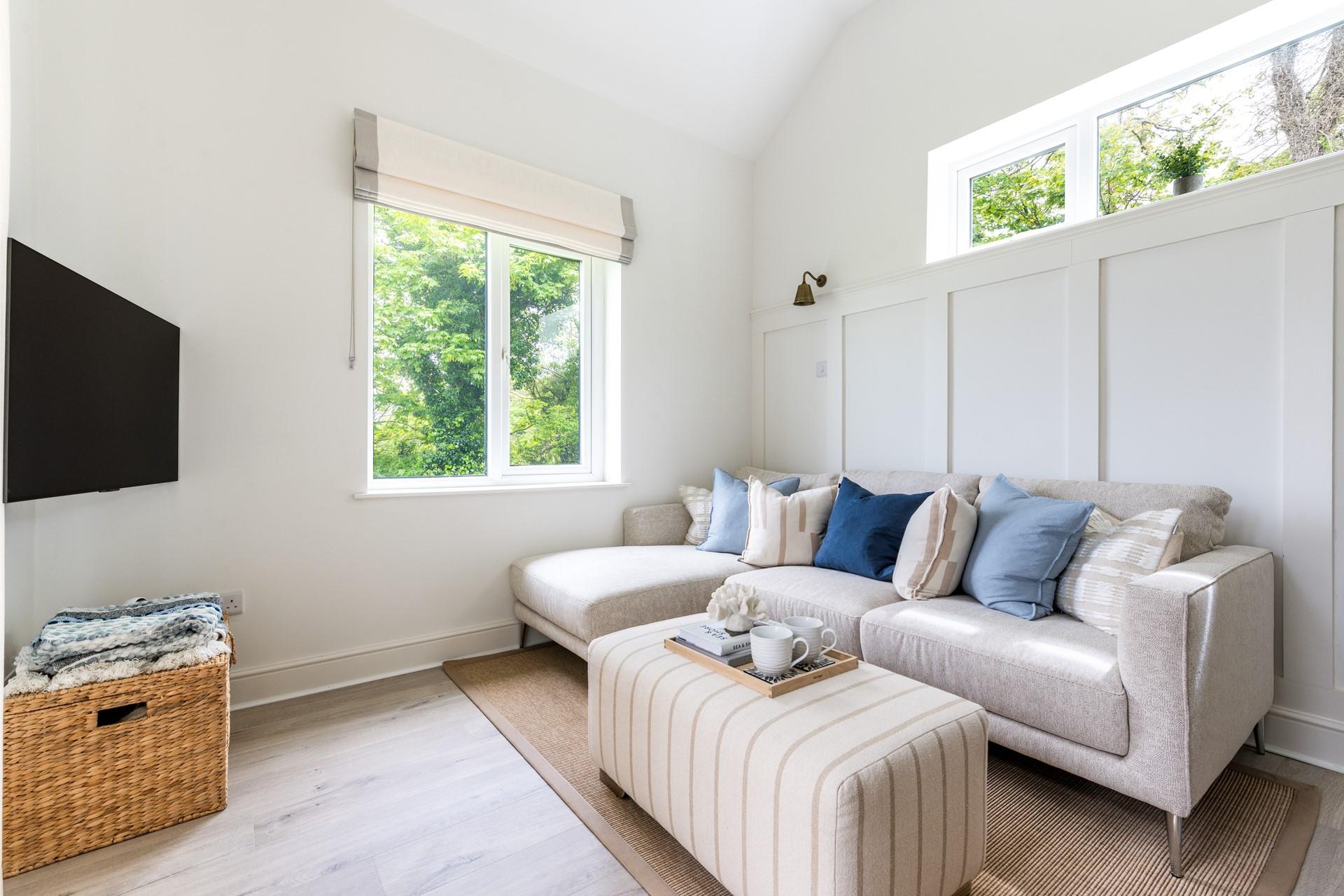 Enjoy a movie night in the modern sitting room after a day spent on Carbis Bay beach.