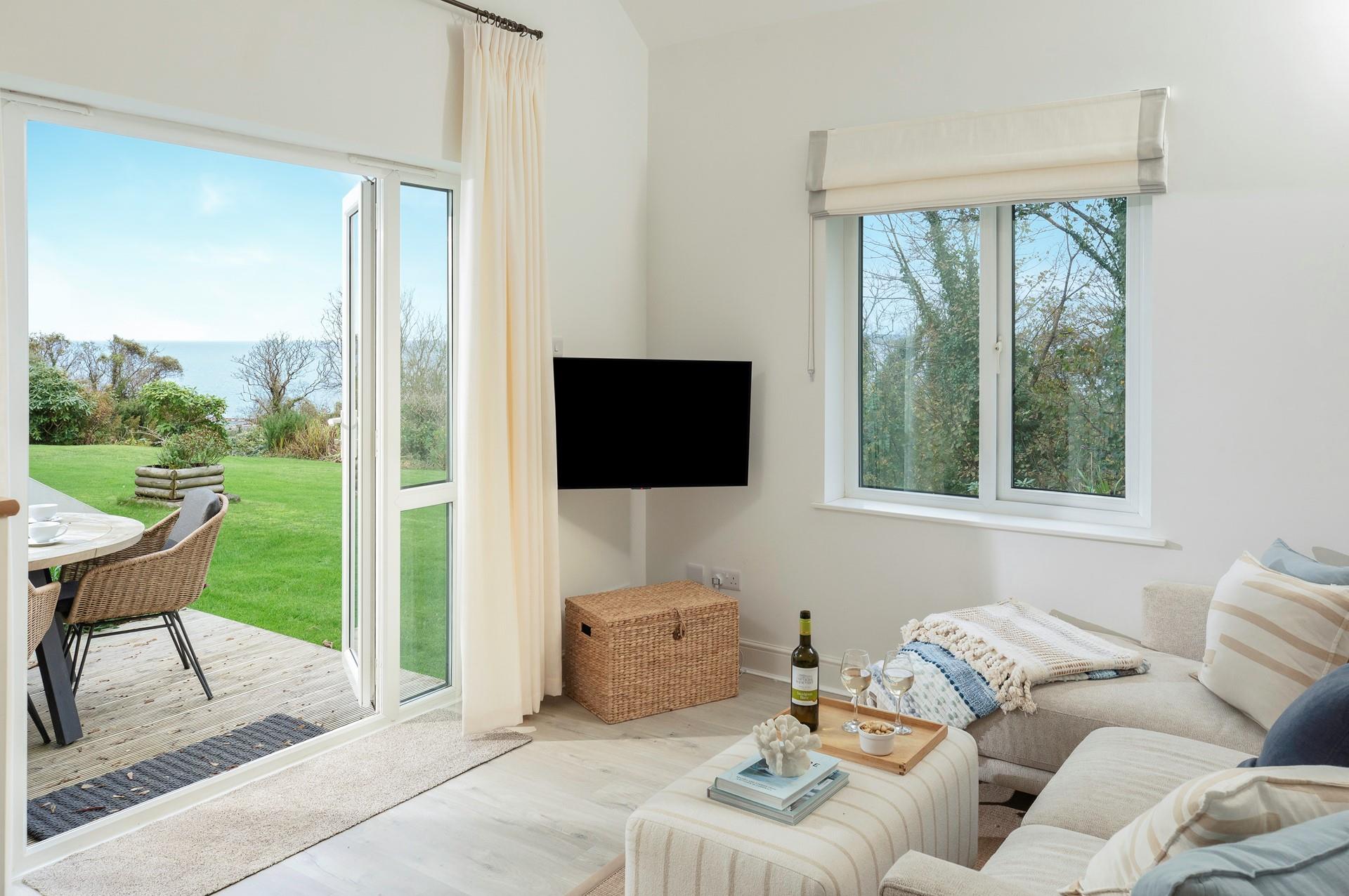 Unwind on the cosy sofa after a day of exploring the nearby coast path.