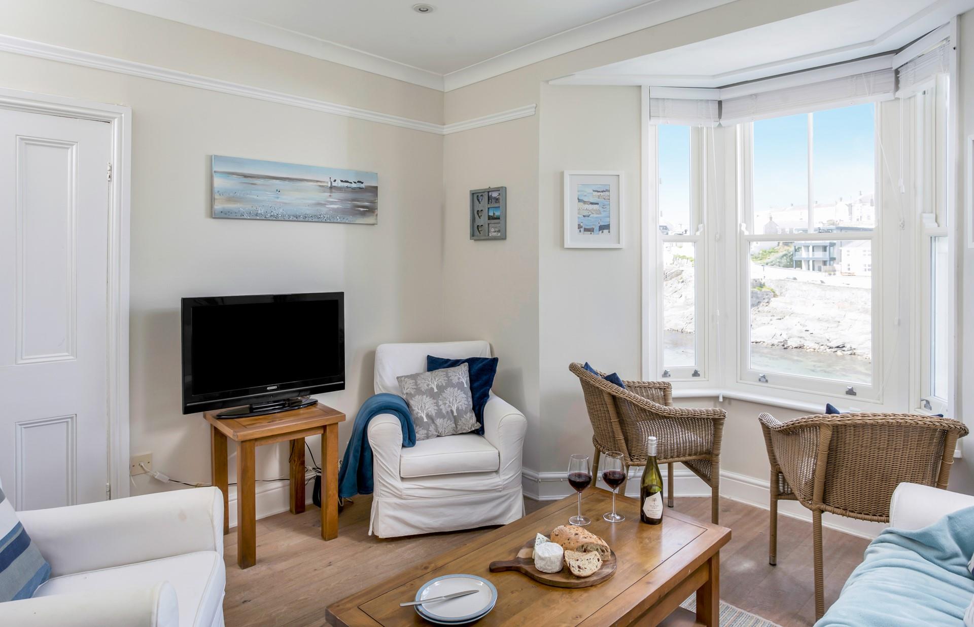 The second sitting room also has a TV, a great space for the kids to relax without the adults.