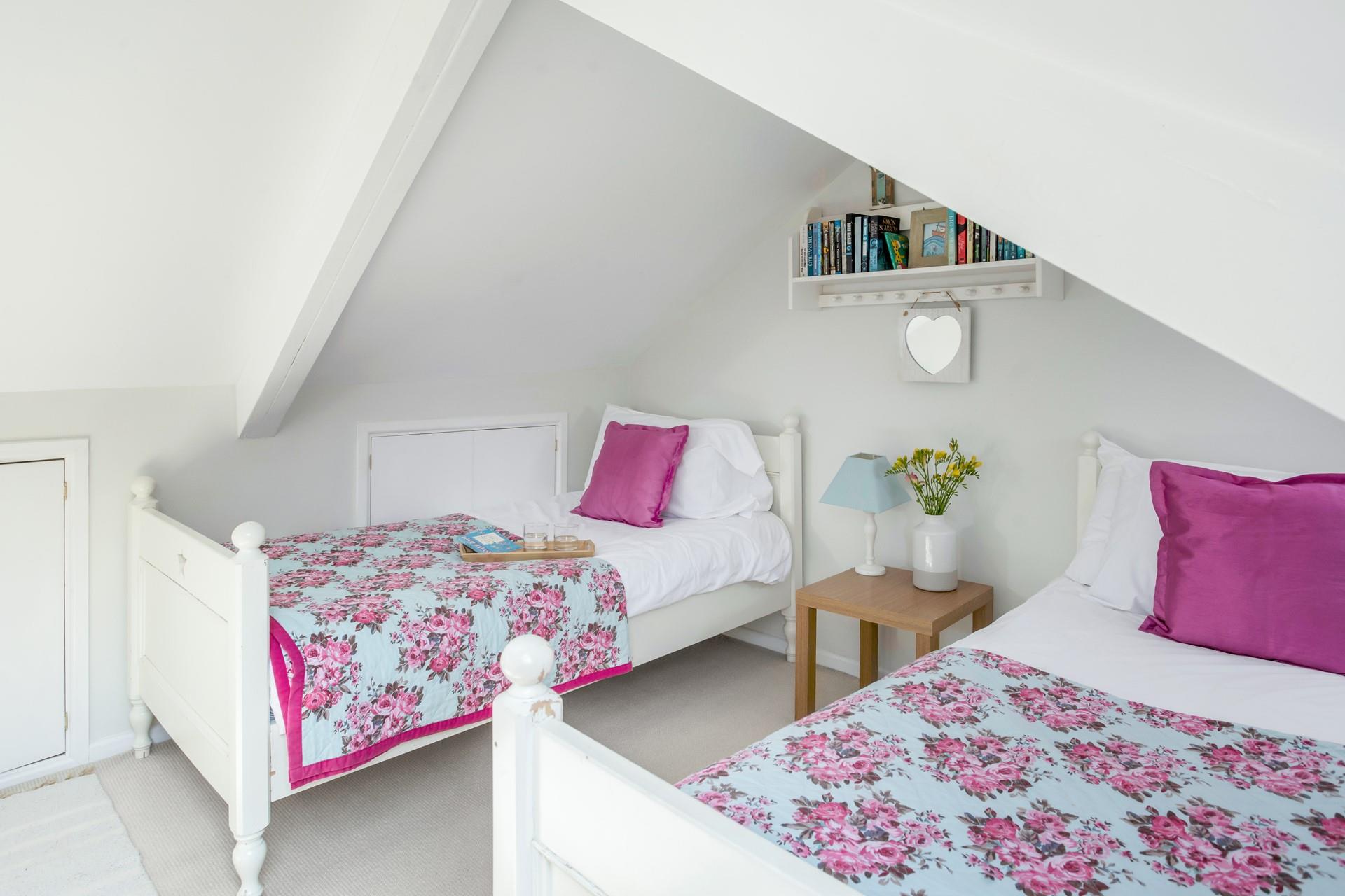Wake up in the bright bedding in the twin room ready for the day.