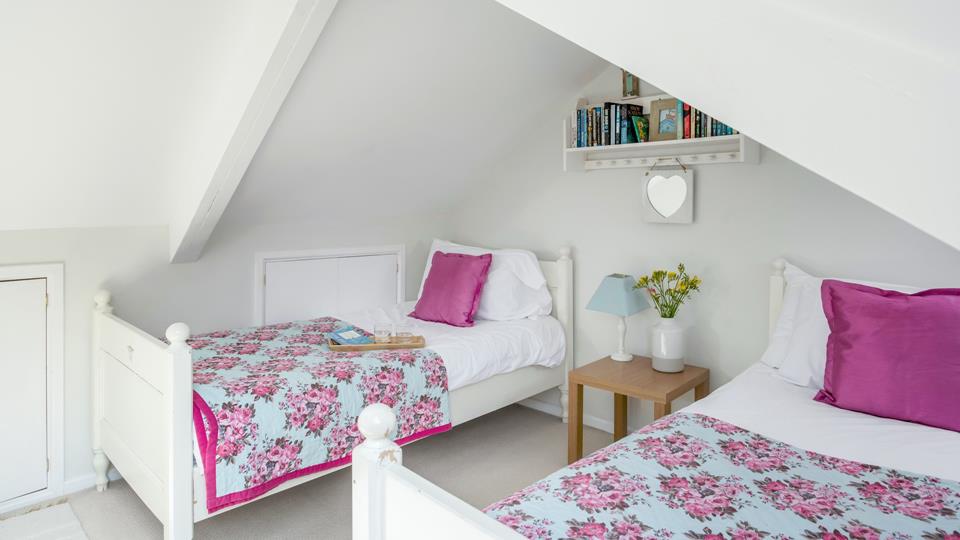 Wake up in the bright bedding in the twin room ready for the day.