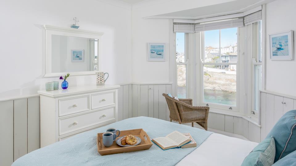 Enjoy views of the harbour from the comfort of the bed.
