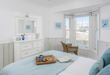Enjoy views of the harbour from the comfort of the bed.