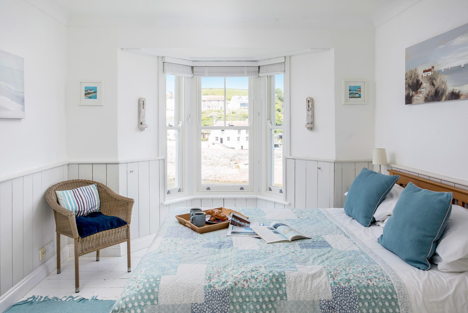 The blue pastel tones in bedroom 1 create a calming space to rest and rejuvenate.