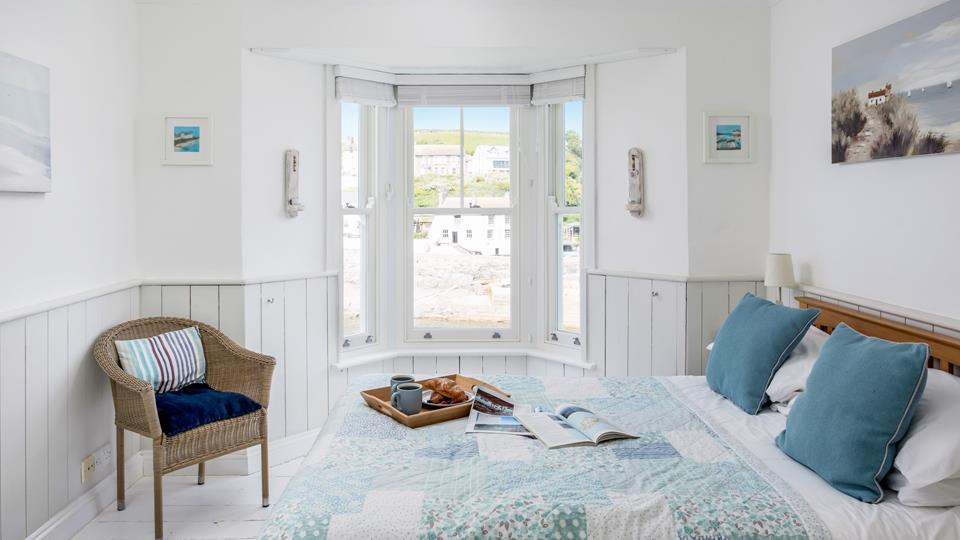 The blue pastel tones in bedroom 1 create a calming space to rest and rejuvenate.