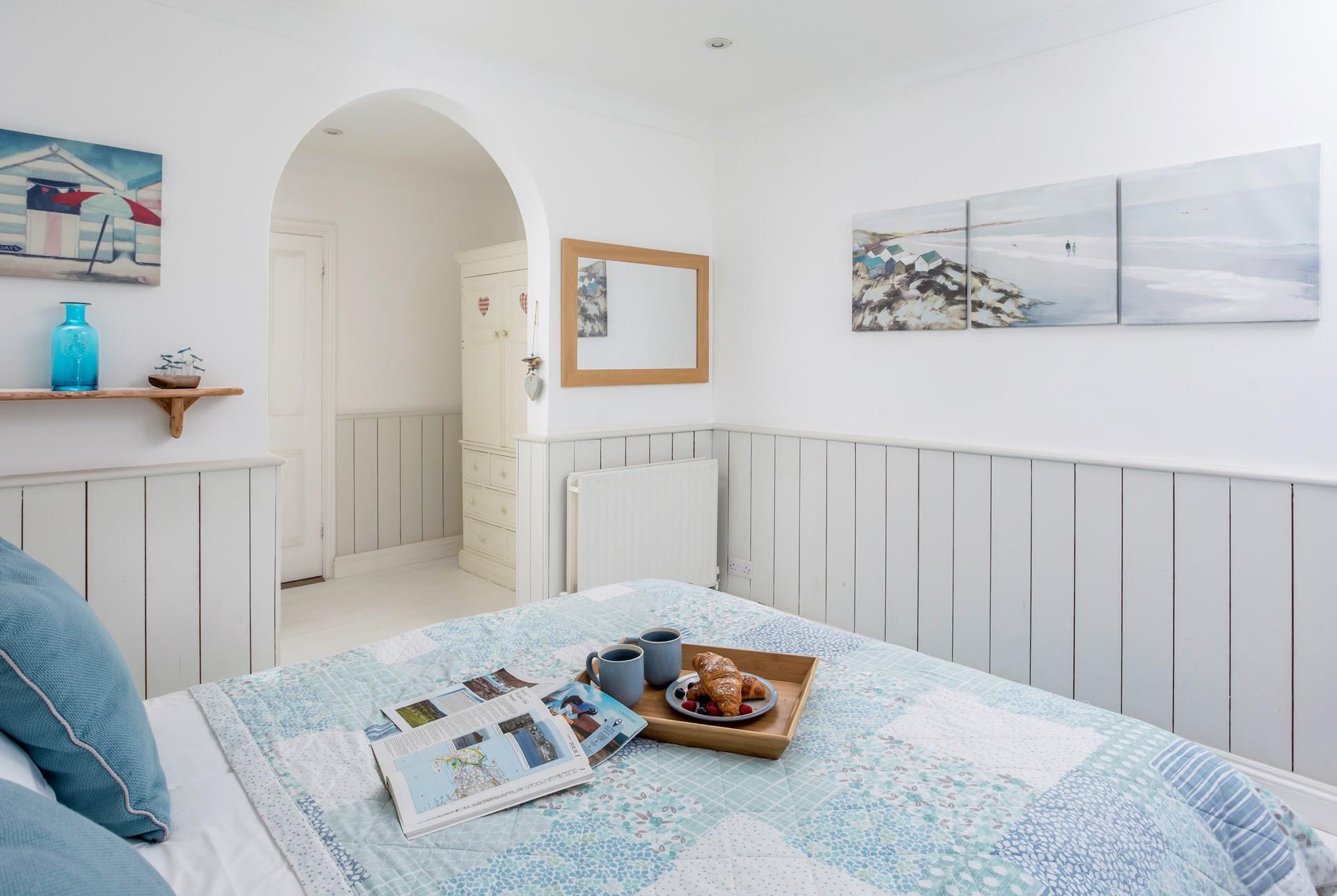 Bedroom 1 is spacious and light and offers a dreamy night's sleep.