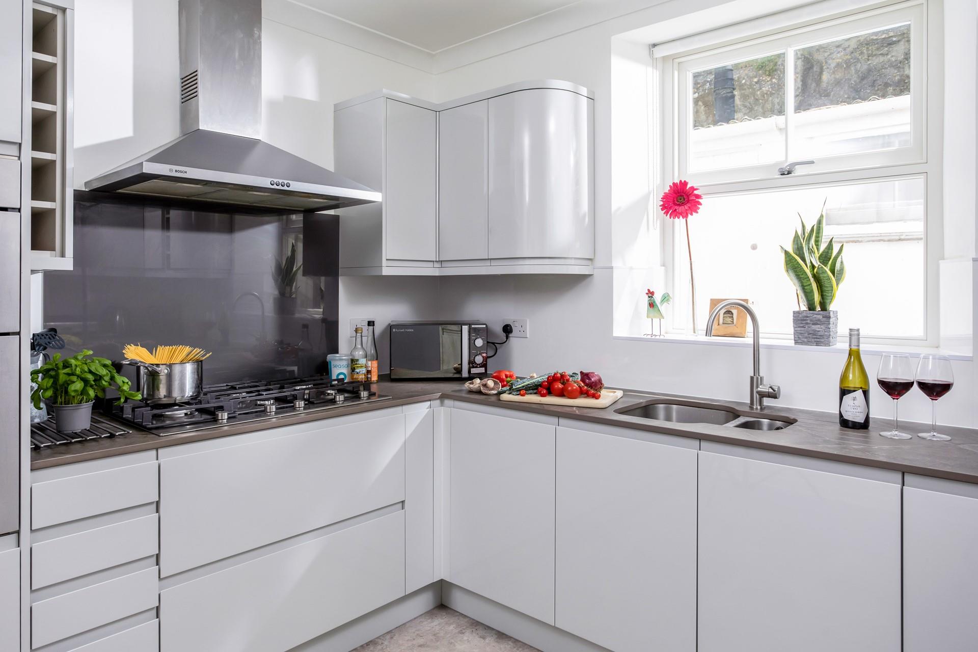 Get some fresh ingredients from the local shops in Porthleven and cook a feast.