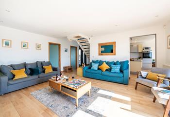 Blues and yellows in the sitting room reflect the wonderful seaside location.