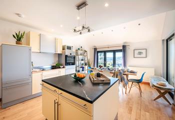 The kitchen is modern and has ample work top space.