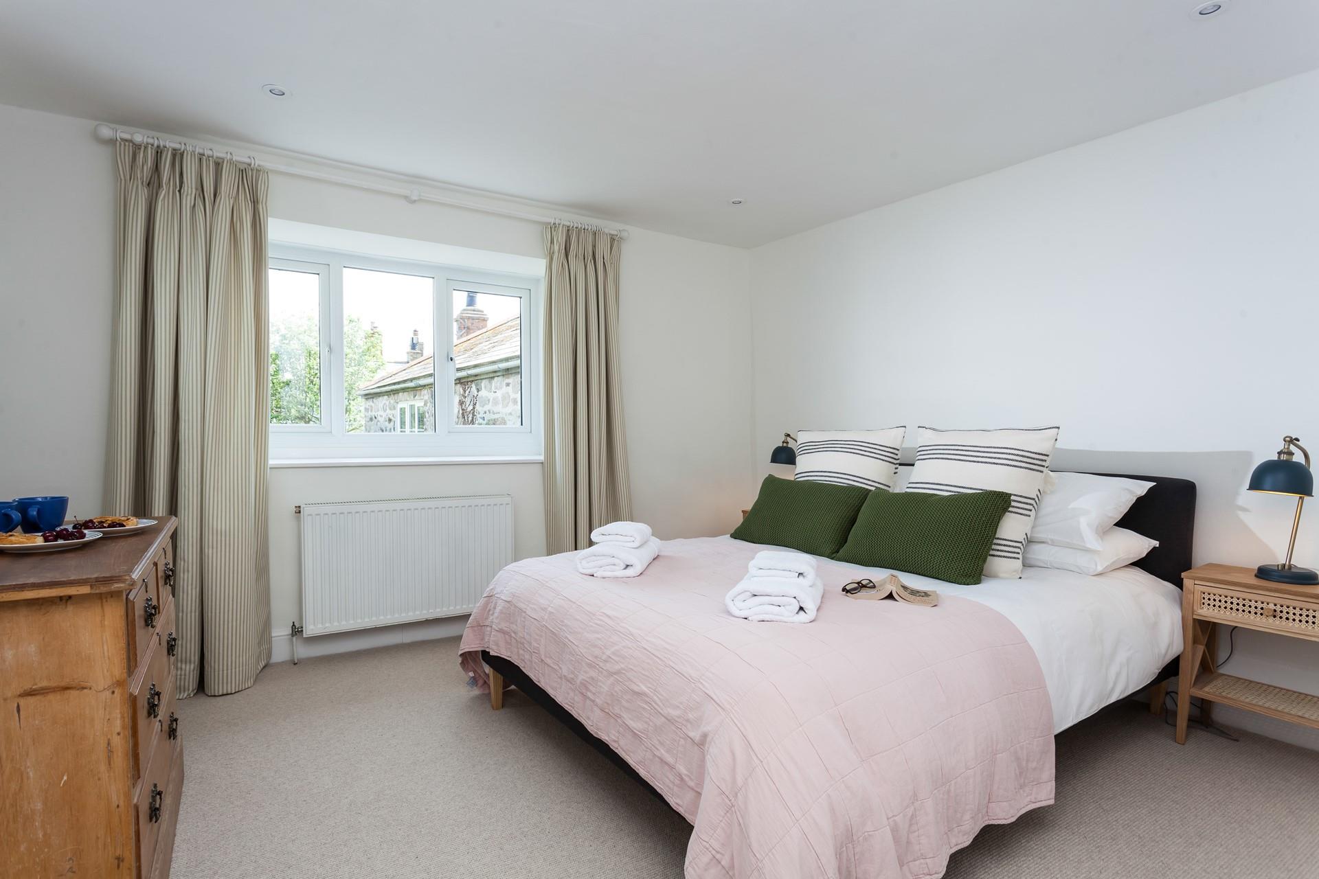 Bedroom 3 is spacious with a luxurious king size bed.