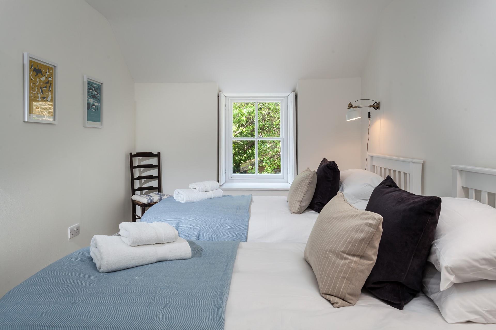 Bedroom 2 has sumptuous twin beds for sinking into after busy days.