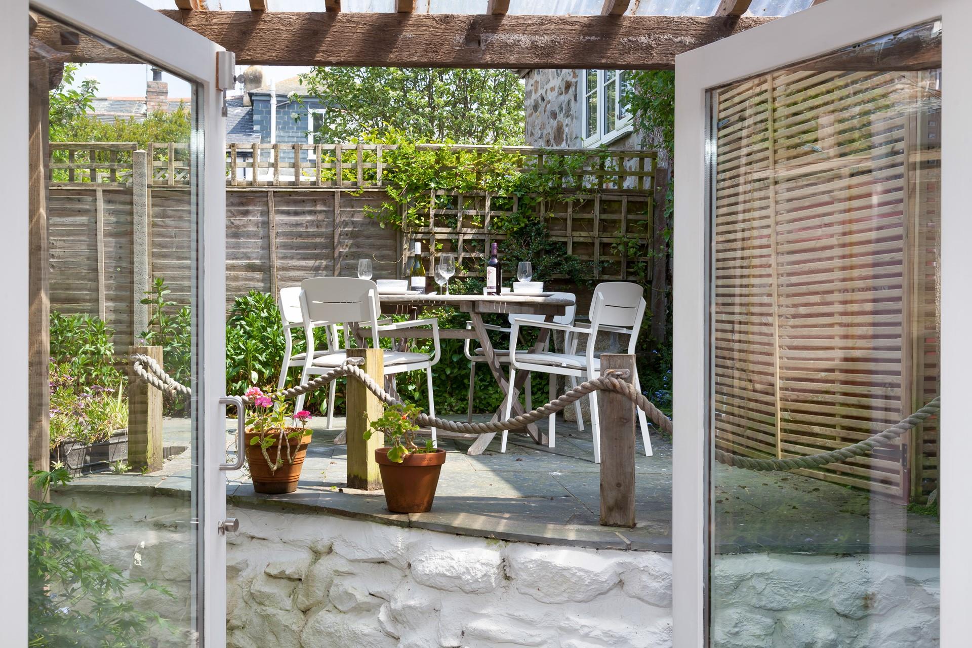 Soak up the sun in the courtyard garden over a glass of wine.