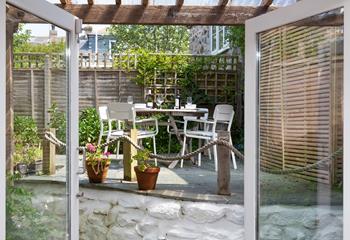 Soak up the sun in the courtyard garden over a glass of wine.