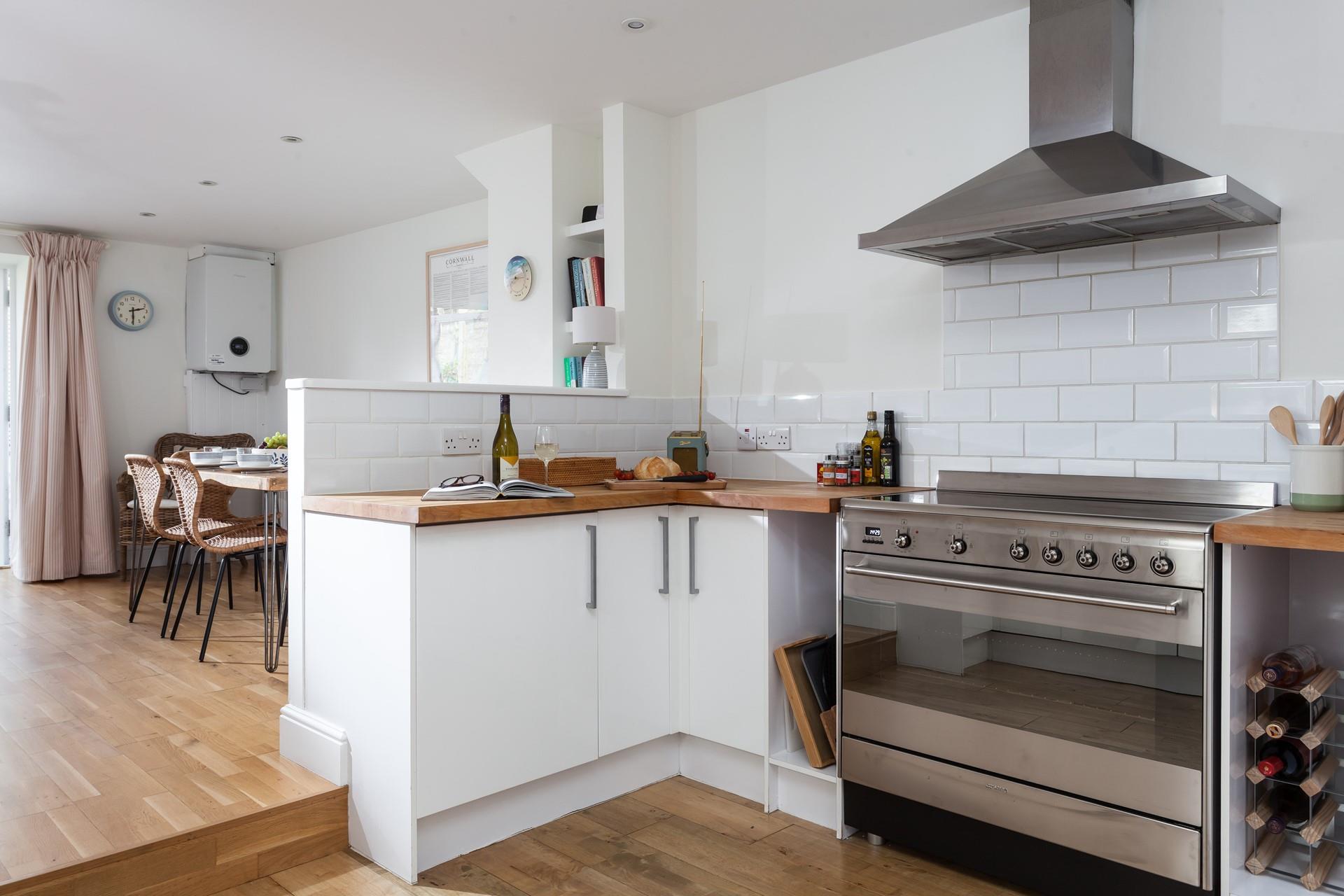 The kitchen is modern and fully equipped for cooking tasty meals.