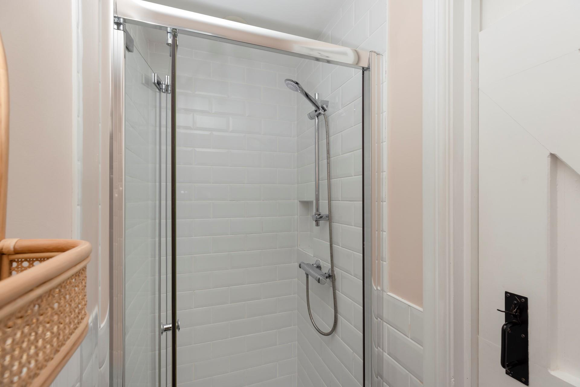 Freshen up in the modern shower room after a day on the beach.