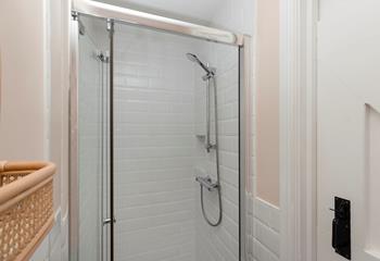 Freshen up in the modern shower room after a day on the beach.
