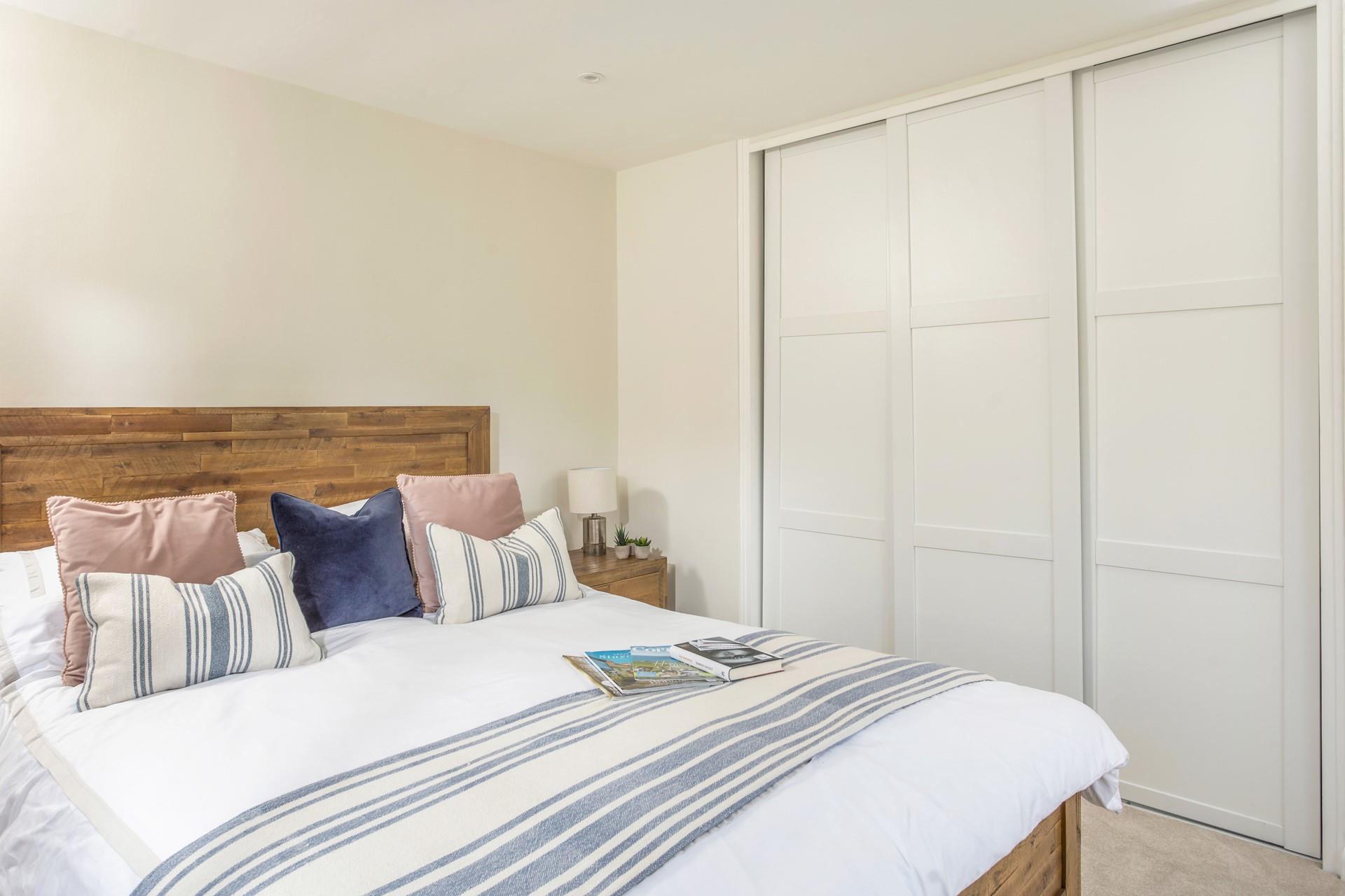 Bedroom 1 is stylishly decorated and has lots of wardrobe space.