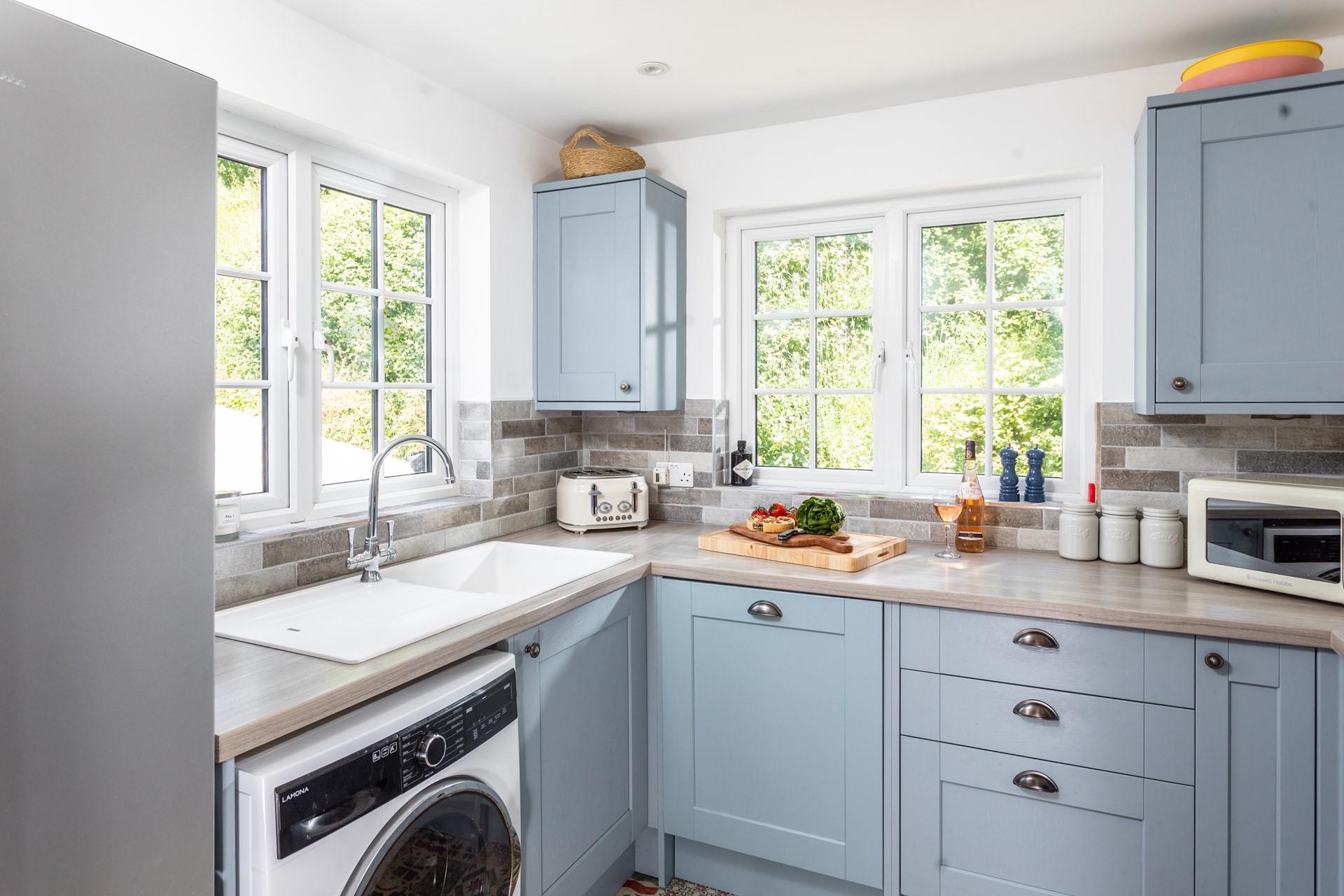 The kitchen is modern and well-equipped for cooking tasty meals with fresh ingredients.