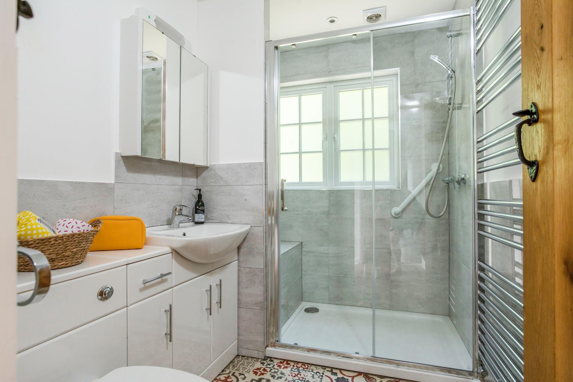 Wash off sandy toes in the shower after a day spent on the beach.