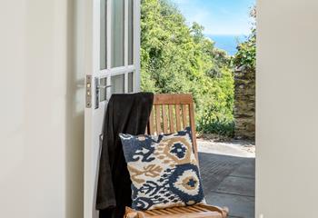 Bedroom 2 has a door leading out to the outside area, perfect for taking your morning cuppa out in the sunshine.