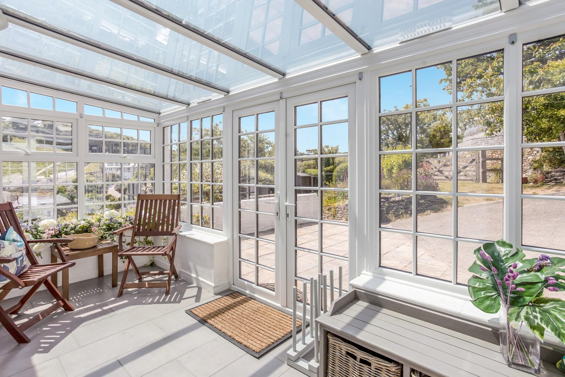 The conservatory is ideal for shoe and coat storage after coming in from a coast path ramble.