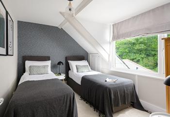 Bedroom 3 has twin beds perfect for young adults or children to tuck into each night.