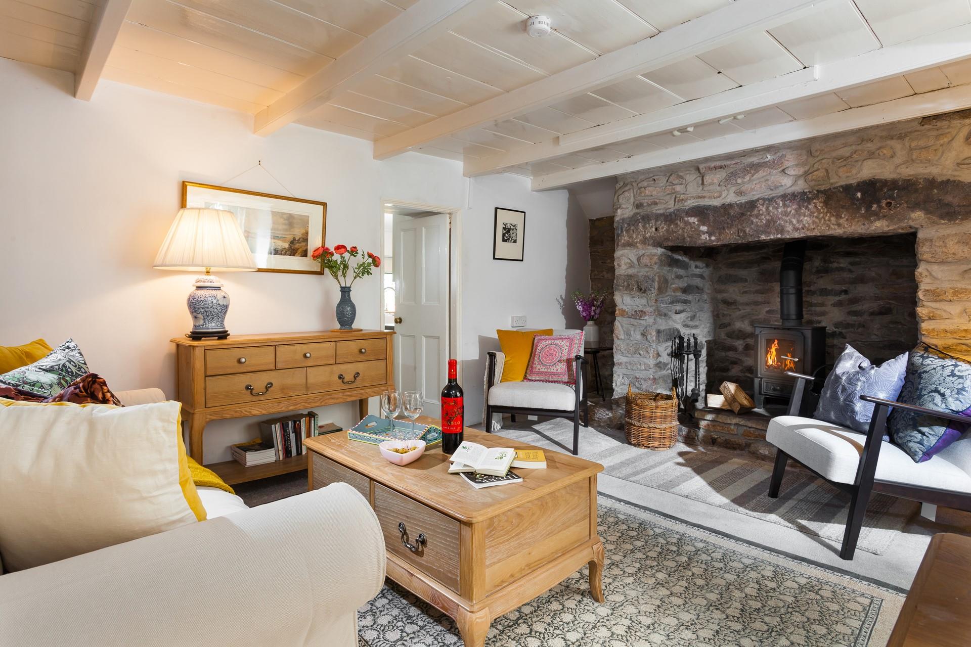 Snuggle up in front of the woodburner and enjoy a glass of wine and a good book.