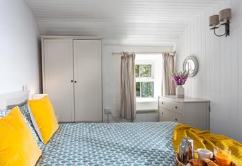 The bedrooms are decorated with natural furnishings with a pop of colour with cushions.