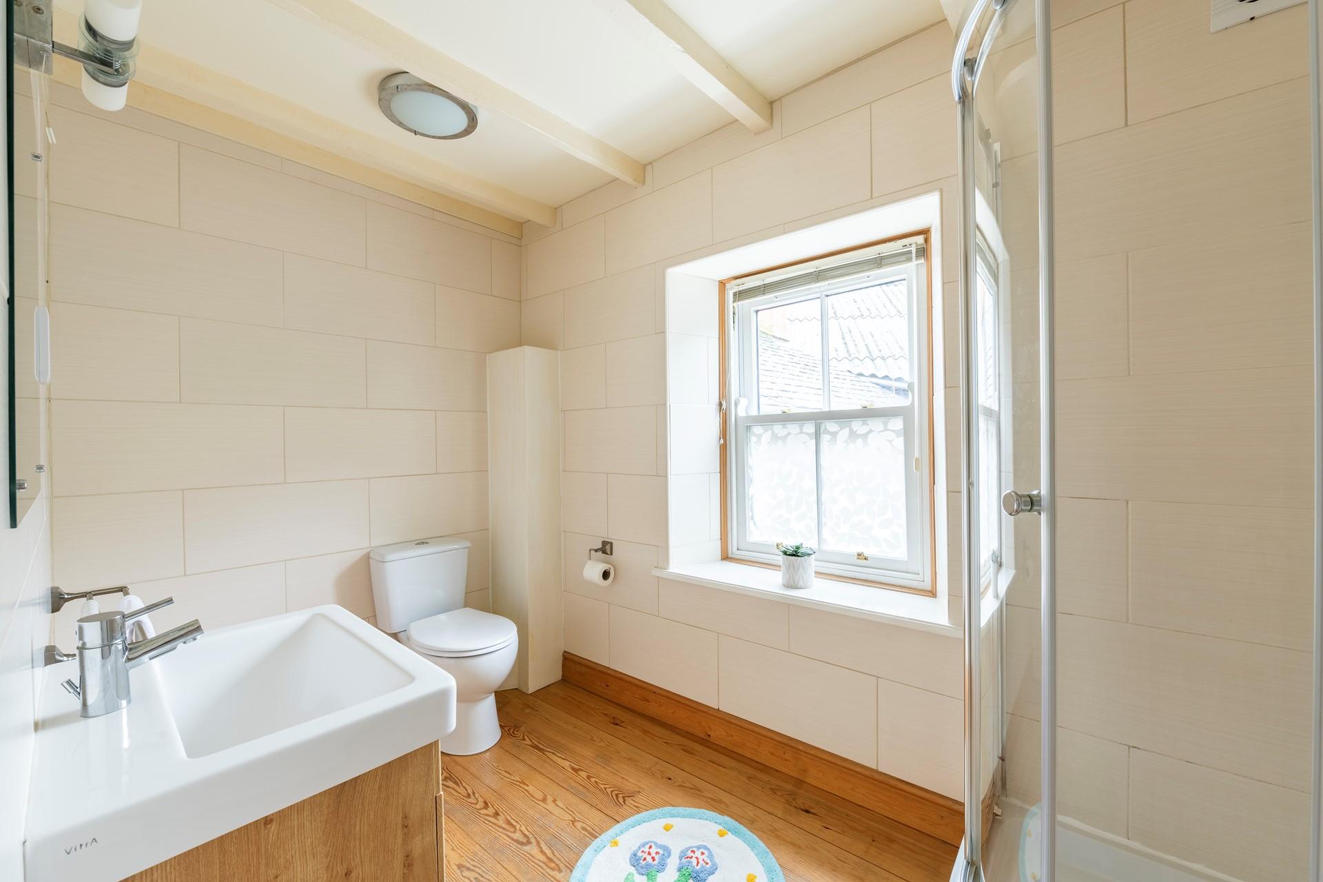 Wash off sandy toes in the shower after a day spent on a nearby sandy beach.