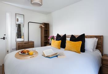 Rustic furnishings with a modern twist in bedroom 3.