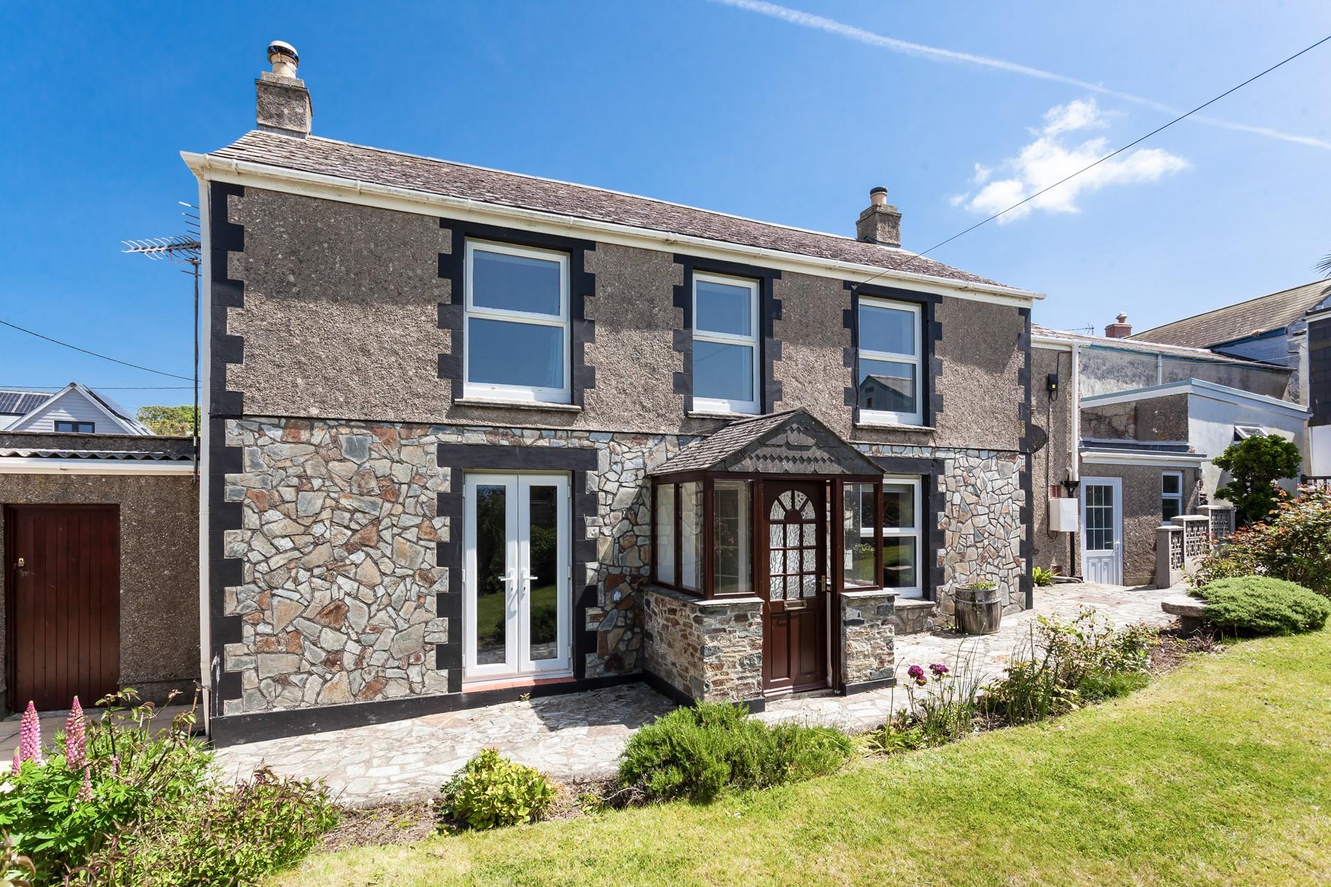 Classic stonework creates a charming welcome at Raymond Cottage.